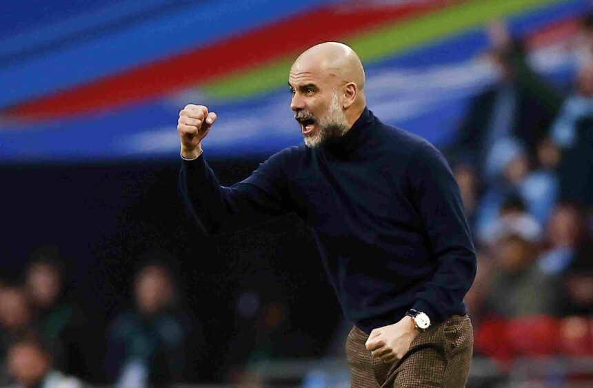 Pep Guardiola esulta dalla panchina